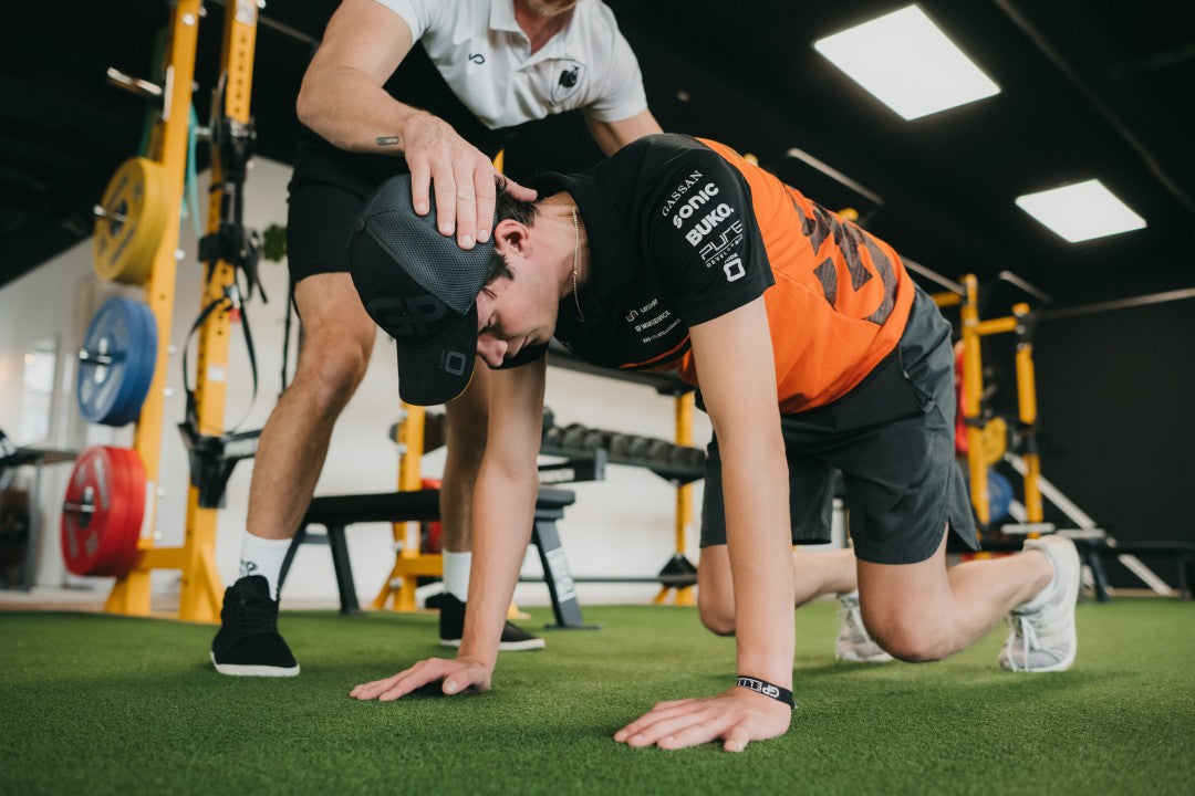 Neck Training for Race Car Drivers: Microdosing, Variations, and Overload Principles