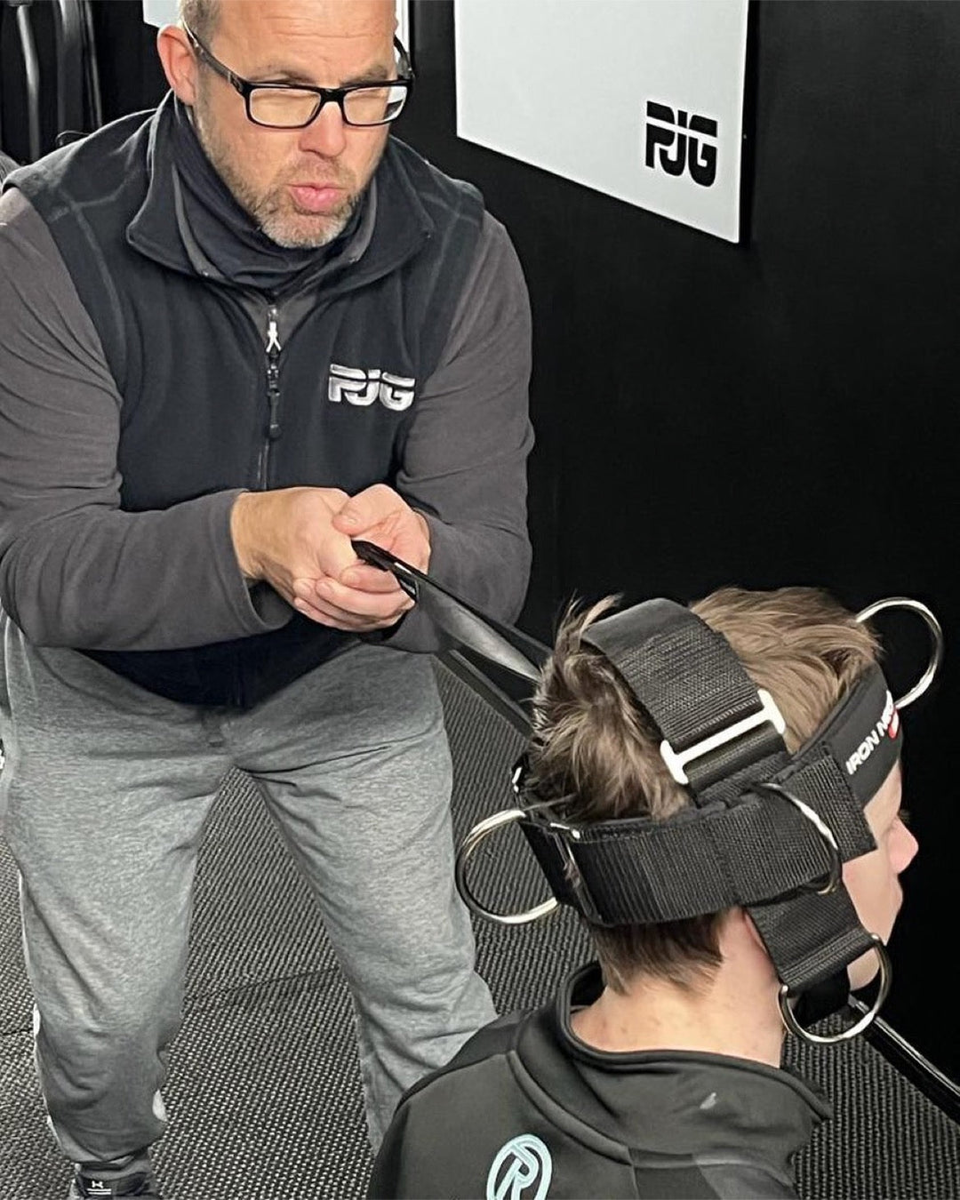 Gridshark Athletic Performance performing a neck strength test