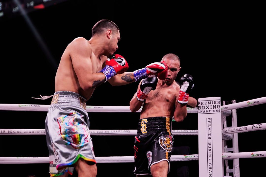 Men boxing in a ring