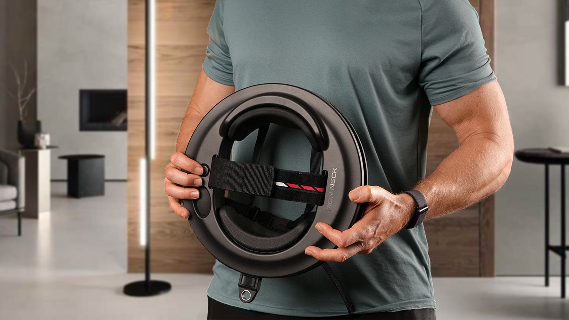 Iron Neck 3.0 Pro being held by a male.